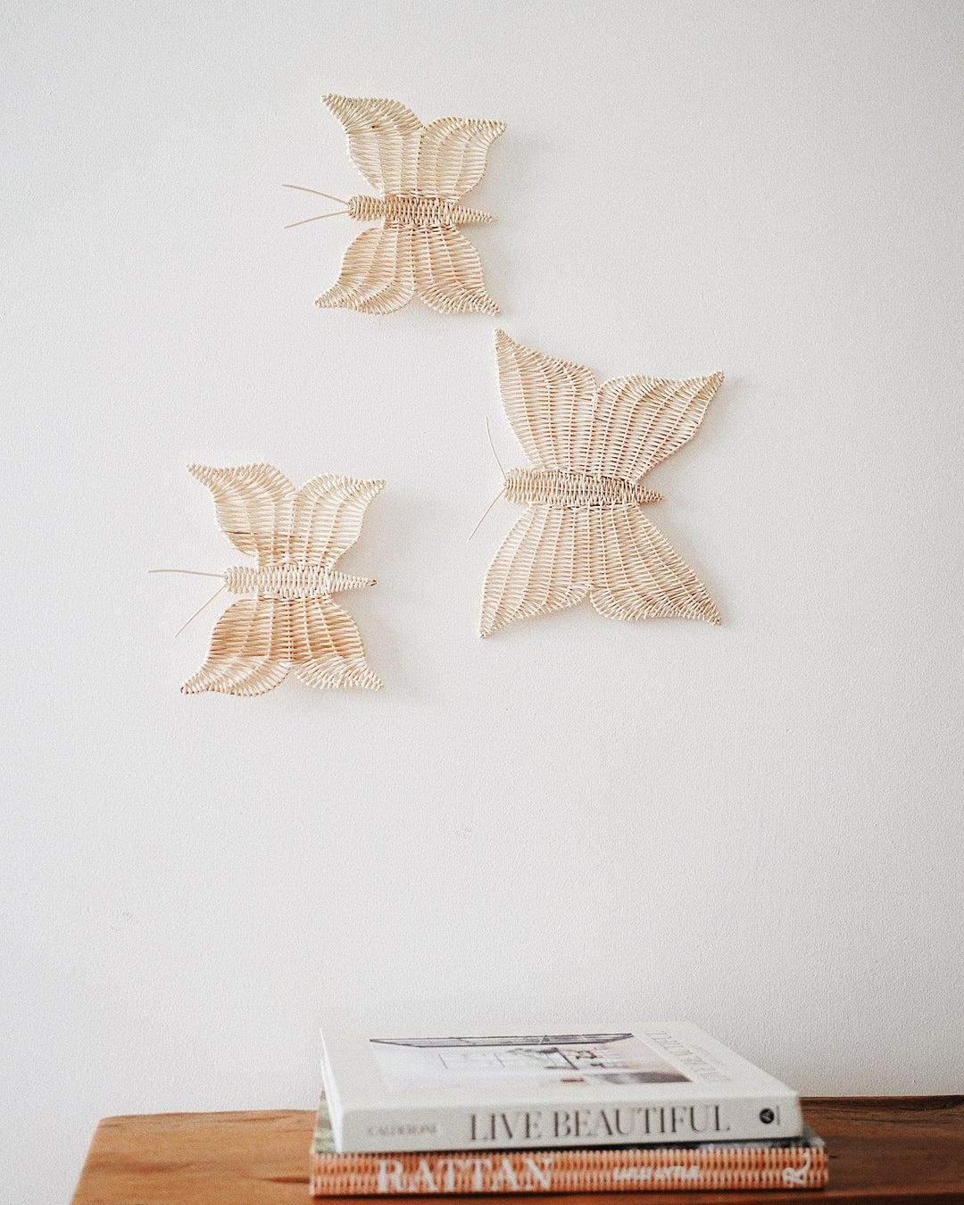 Handcrafted butterflies rattan wall hanging from Olive & Iris, made from eco-friendly rattan by local artisans.