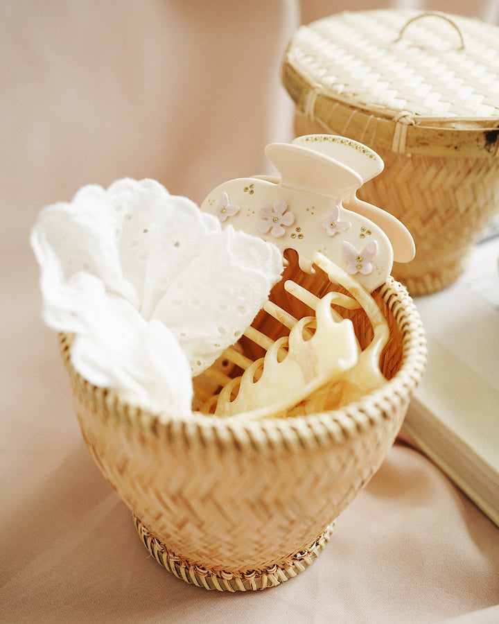 Cloud Bamboo Storage Box used to store jewelry and small items on a dresser, enhancing the room's décor.