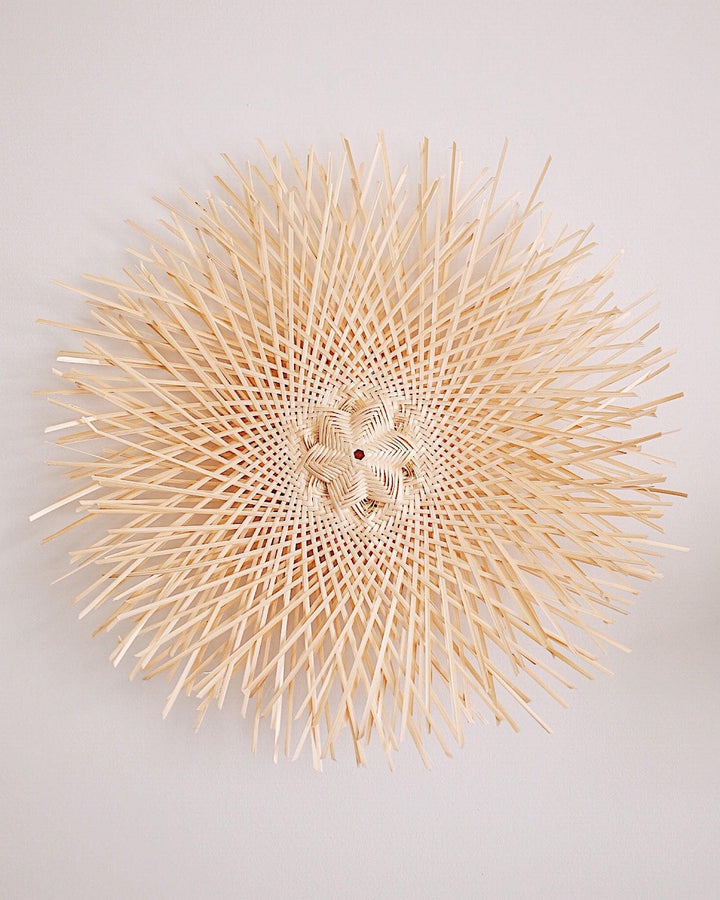 Snowflake Basket Wall Art featuring intricate handcrafted snowflake designs made from natural materials.