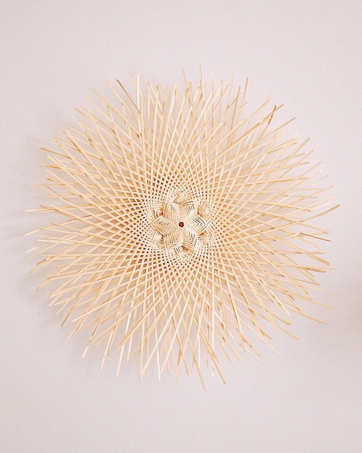 Snowflake Basket Wall Art featuring intricate handcrafted snowflake designs made from natural materials.